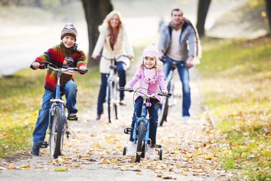 Beautiful family riding bicycles in a park during autumn season. The focus on foreground.   [url=http://www.istockphoto.com/search/lightbox/9786778][img]http://dl.dropbox.com/u/40117171/family.jpg[/img][/url] [url=http://www.istockphoto.com/search/lightbox/9786682][img]http://dl.dropbox.com/u/40117171/children5.jpg[/img][/url]